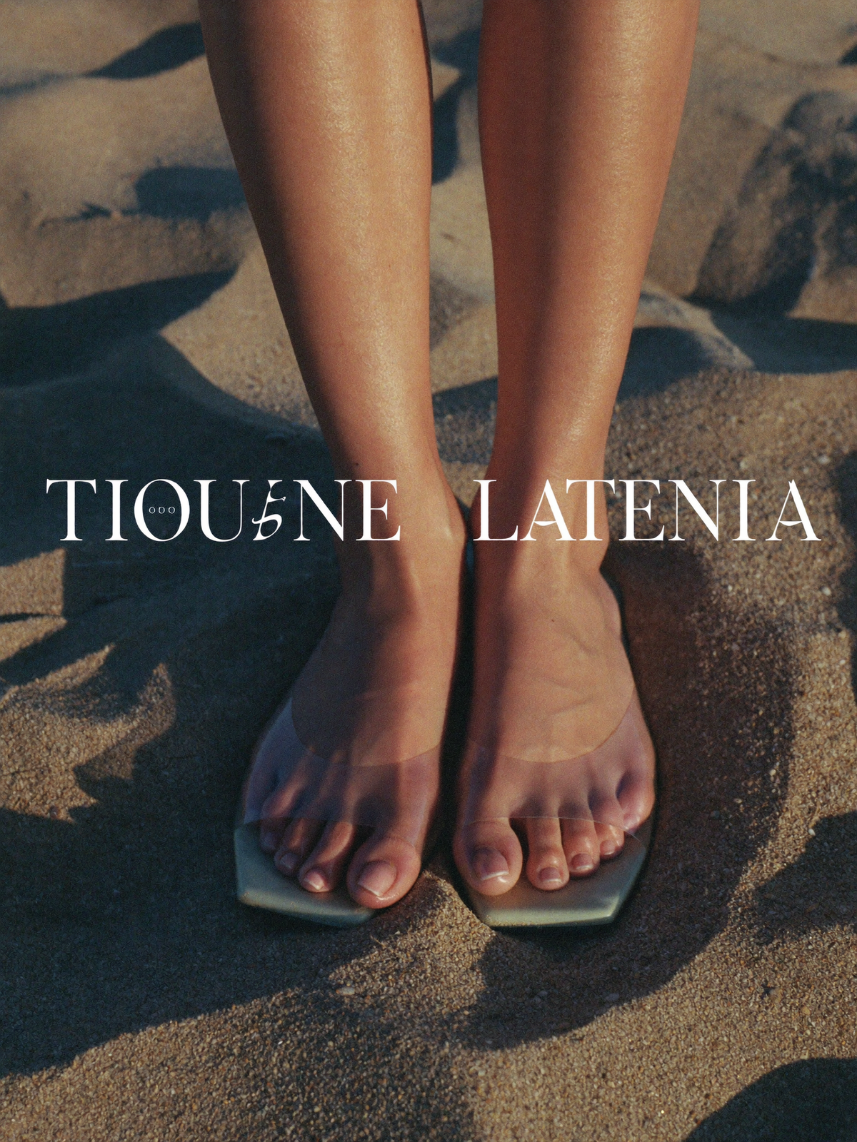 Sunset Flat Sandals worn on beach sand